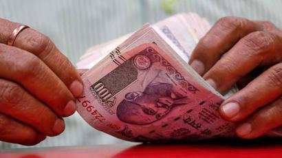 Rupee slips in trade against US dollar after trading at near 1-month high
